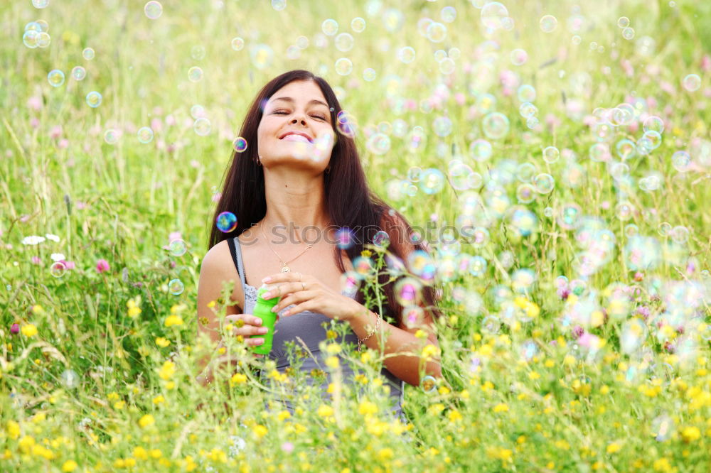 Similar – Image, Stock Photo Beautiful young woman in summer on yellow meadow from rape to horizon. Pretty girl with zest for life enjoys the sunshine break and life. Rest and recharge energy from time stress in environment and nature idyll. Laterally from behind.