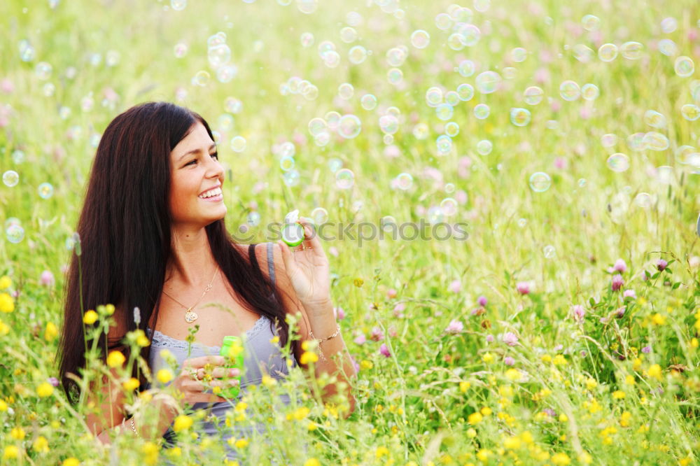 Similar – Image, Stock Photo Happy summer love woman sitting smiling in canola field. Attractive young beauty girl enjoying the warm sunny sun in nature, taking time to feel sustainability, reflection and youthful well-being.