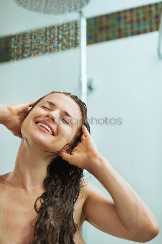 Similar – Young woman reacting in shock under shower