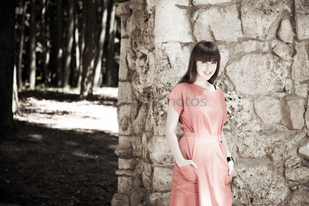 Similar – beautiful girl with short haircut and wearing black clothes in countryside enjoying the sunset