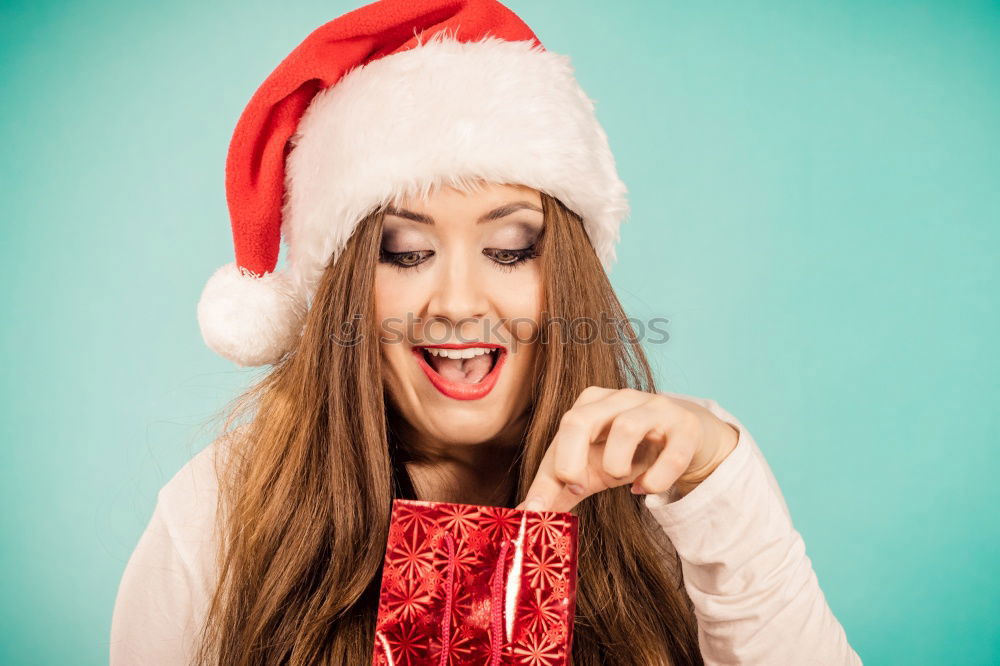 Similar – Image, Stock Photo Young woman with Christmas hat in the forest