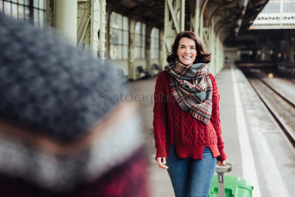 Similar – Fröhliches Mädchen steigt am Bahnhof mit Kaffee in der Hand in den Zug ein.