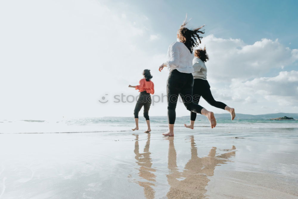 Similar – Image, Stock Photo Women with arms raised standing on the cliff