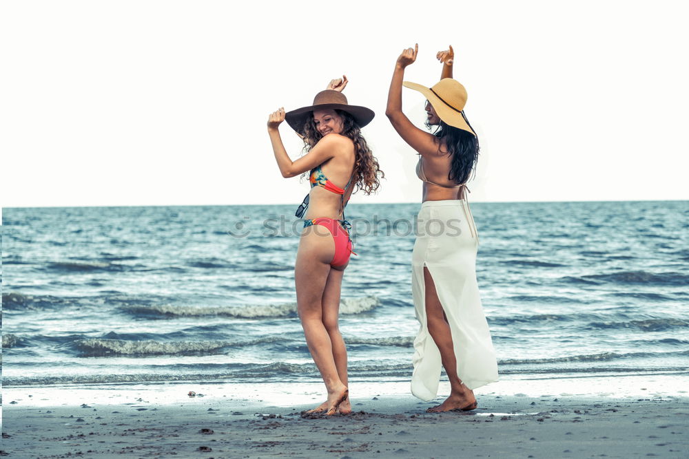 Similar – Image, Stock Photo Women with arms raised standing on the cliff