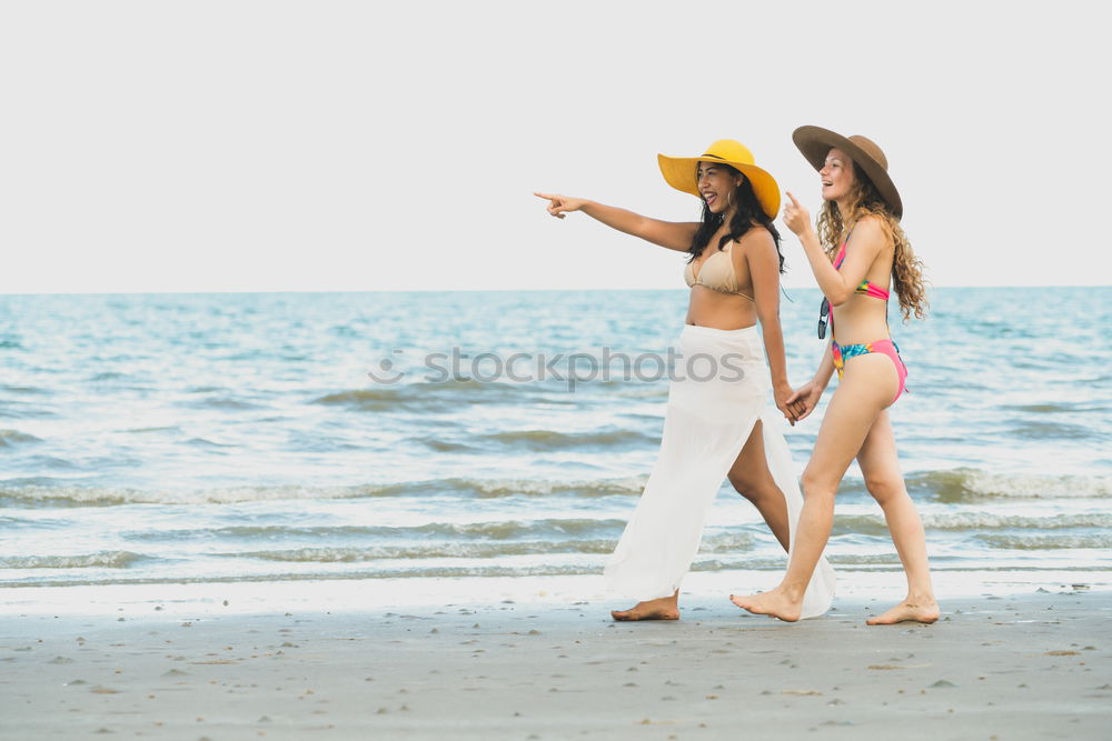 Similar – Image, Stock Photo Mother throwing sunscreen on her little daughter on a tropical beach