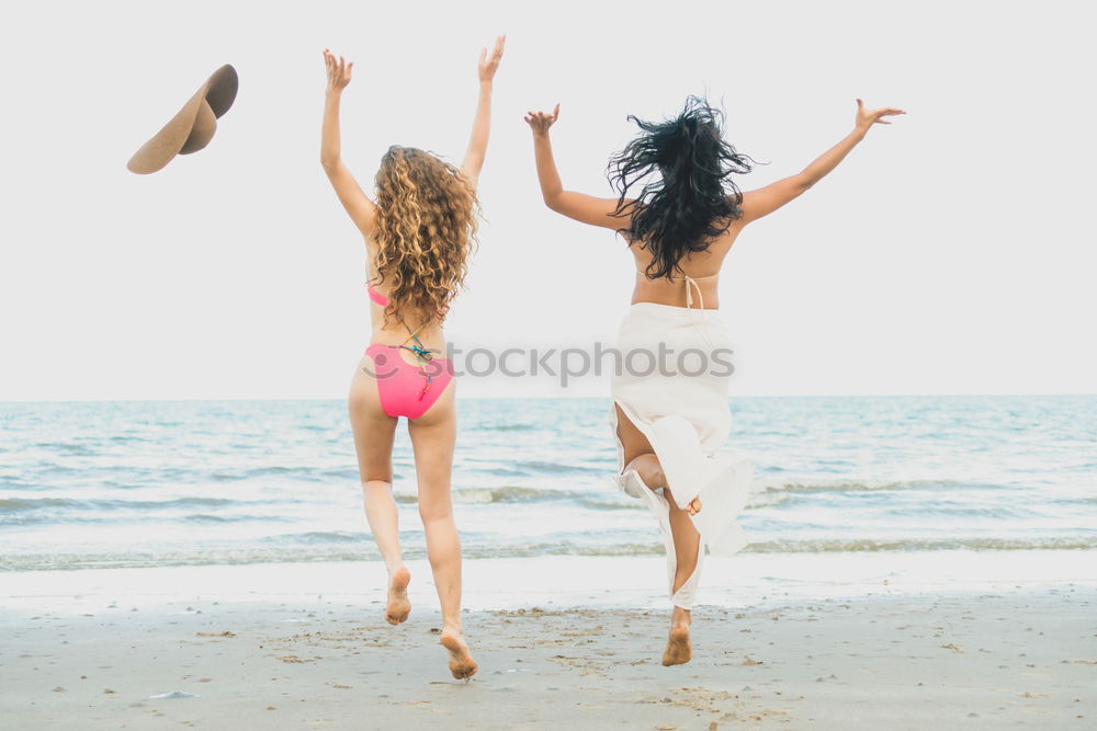 Similar – Women posing in sandy hills