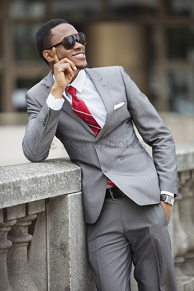 Similar – Handsome black man wearing suit in urban background