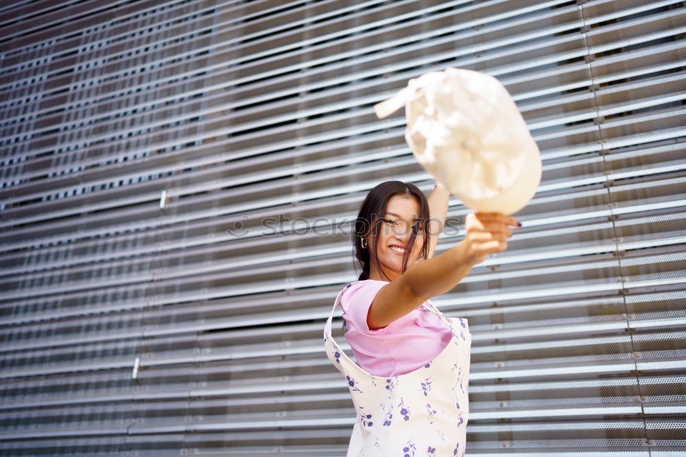 Similar – Woman fanning herself.