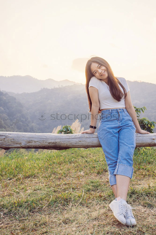 Similar – Happy girl posing on the stones of a river