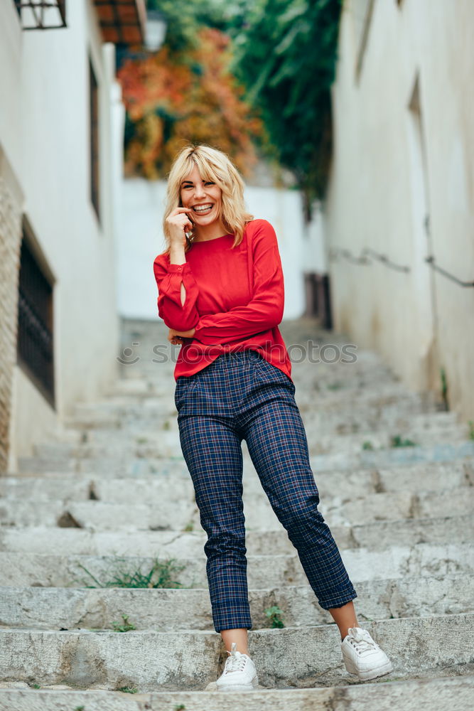 Similar – Blonde girl with red shirt enjoying life outdoors.