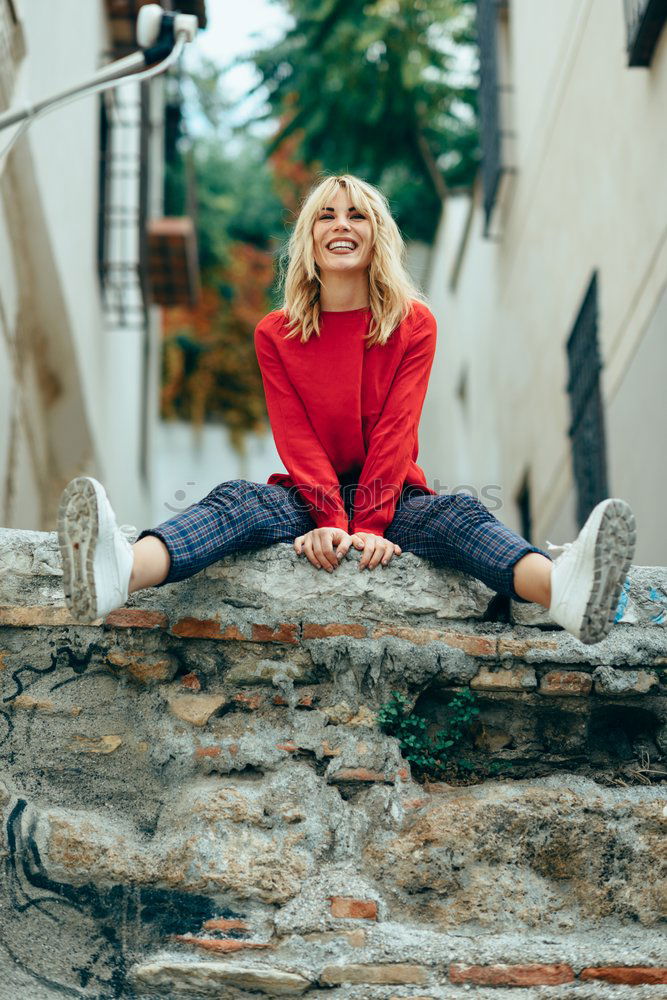 Similar – Smiling blonde girl with red shirt enjoying life outdoors.