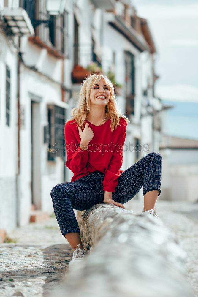 Similar – Blonde girl with red shirt enjoying life outdoors.