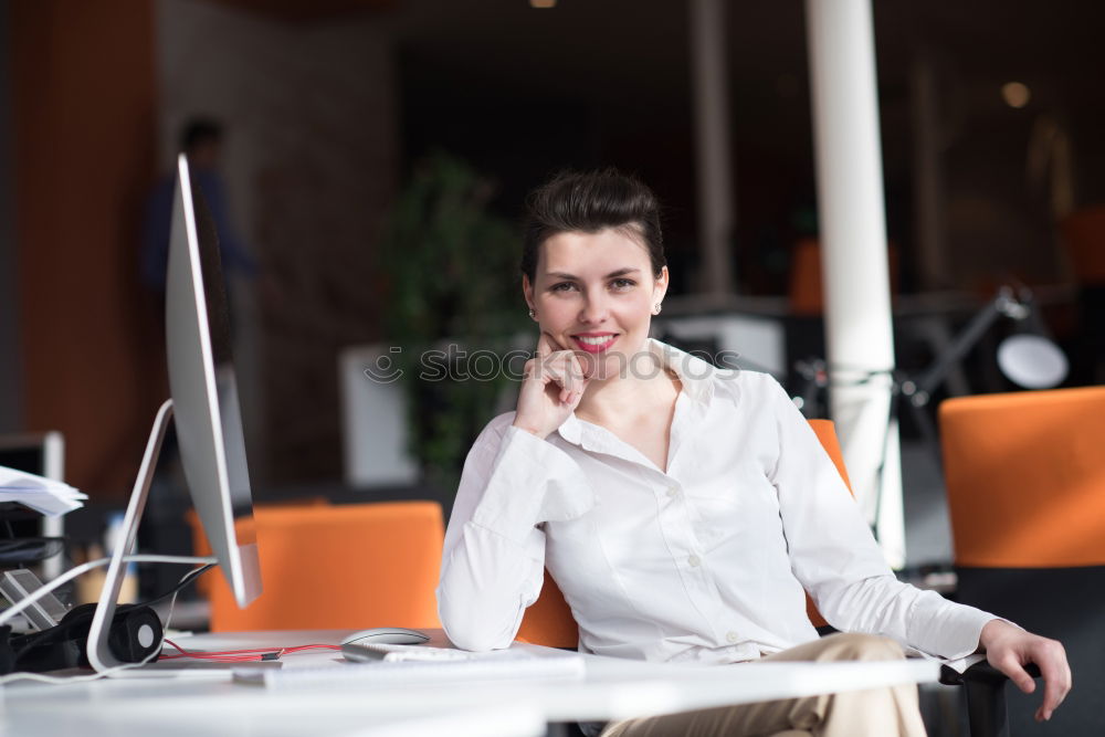 Similar – Woman in armchair using laptop and drinking coffee