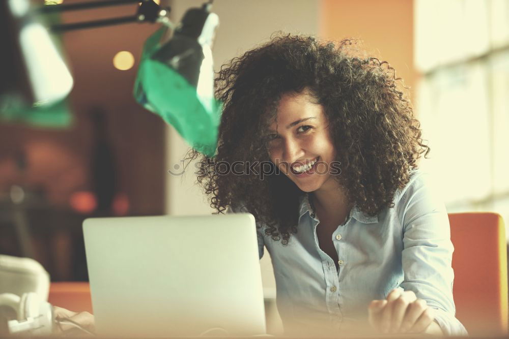 Similar – Beautiful afro american woman using mobile and laptop in the coffee shop.