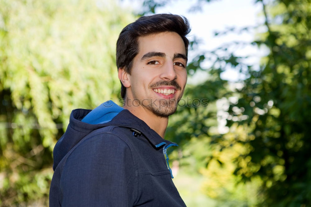 Similar – Image, Stock Photo Young man in sportswear leaning on metal fence and posing on sta