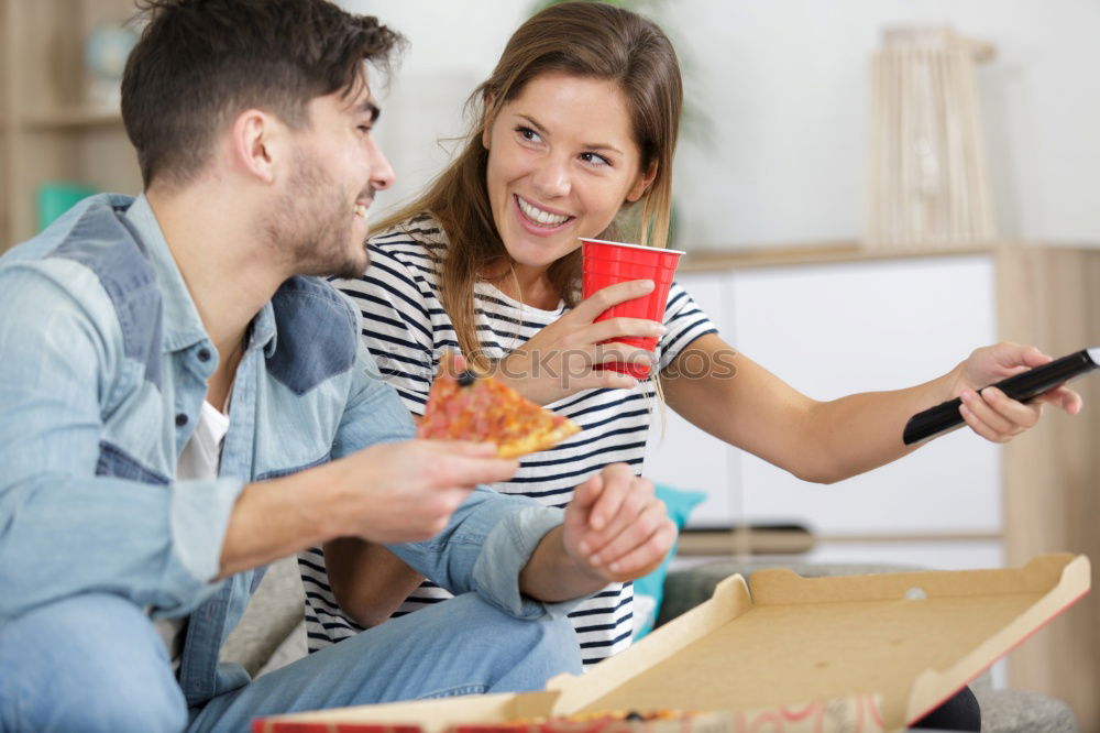 Similar – Happy family at home in the couch playing classic table games