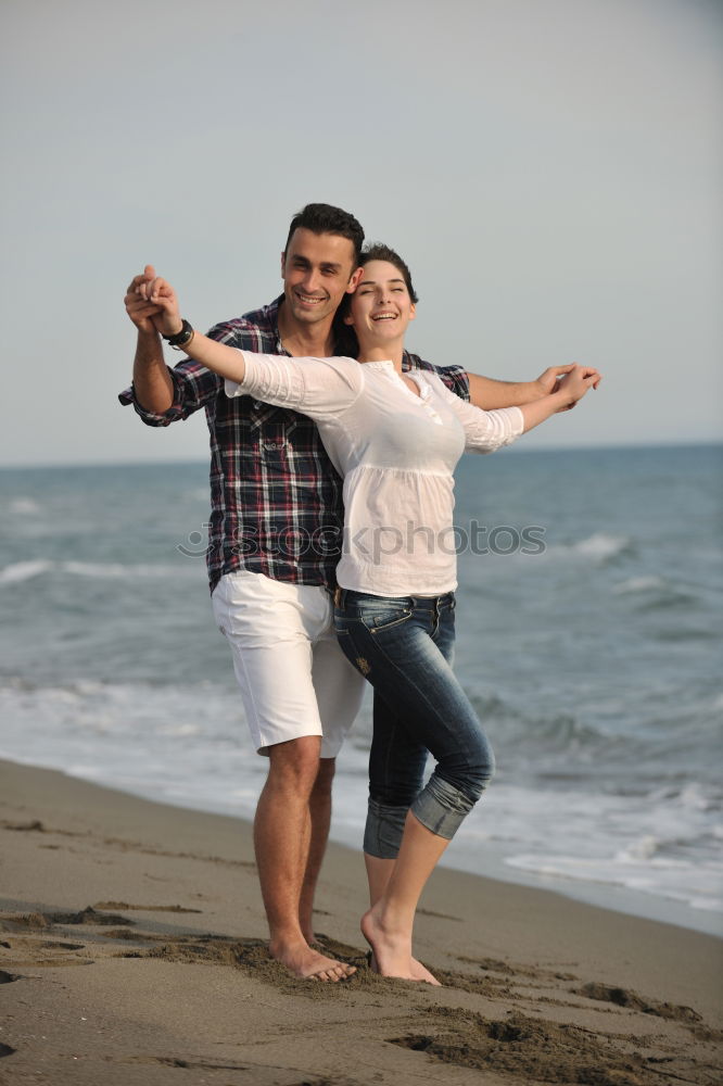 Similar – Happy father and son playing on the beach