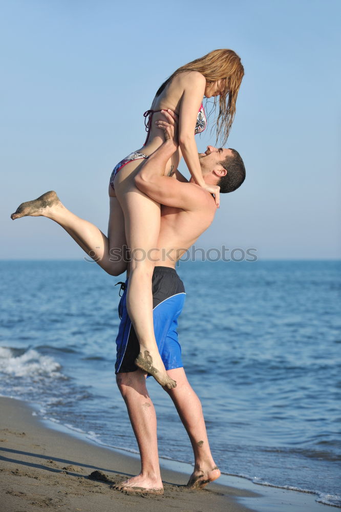 Similar – Image, Stock Photo Two adults training on the beach together