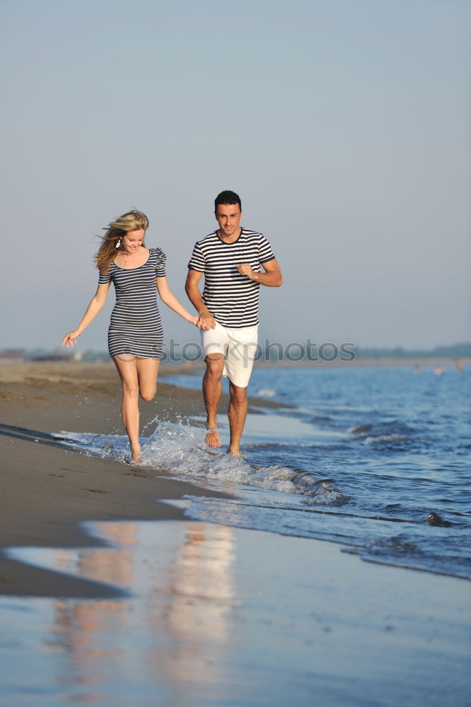 Similar – Image, Stock Photo Happy children playing on the beach at the day time.