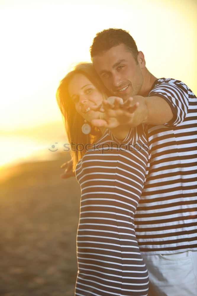 Similar – Image, Stock Photo Unrecognizable hugging couple in sunny street