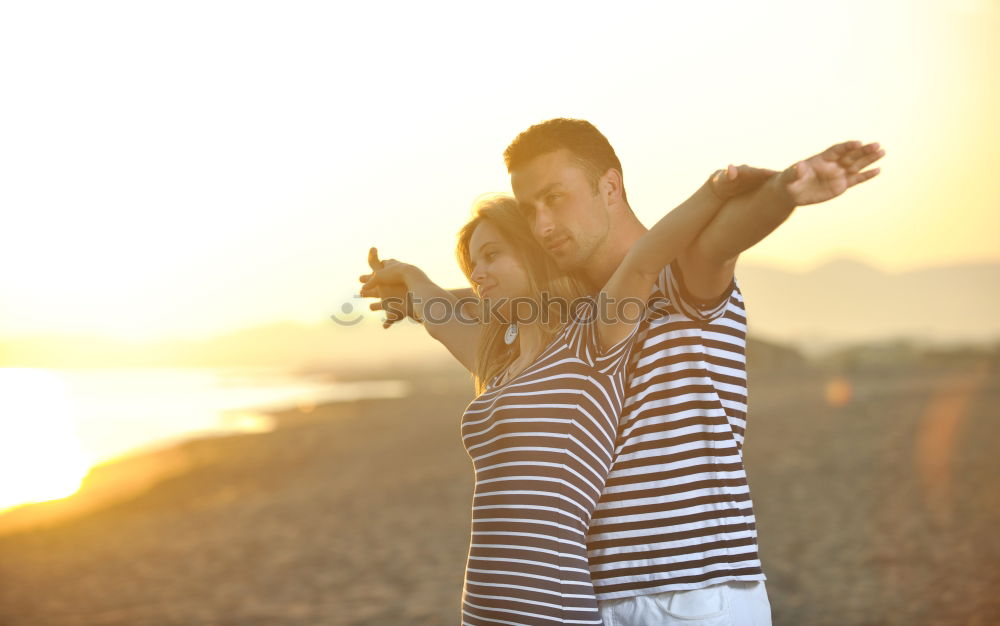 Image, Stock Photo Father and son playing on the beach at the day time. People having fun outdoors. Concept of summer vacation and friendly family.