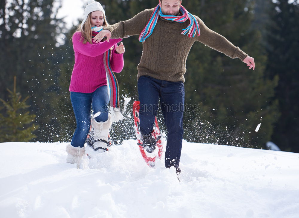 Similar – Young family with children go sledding in winter sunshine