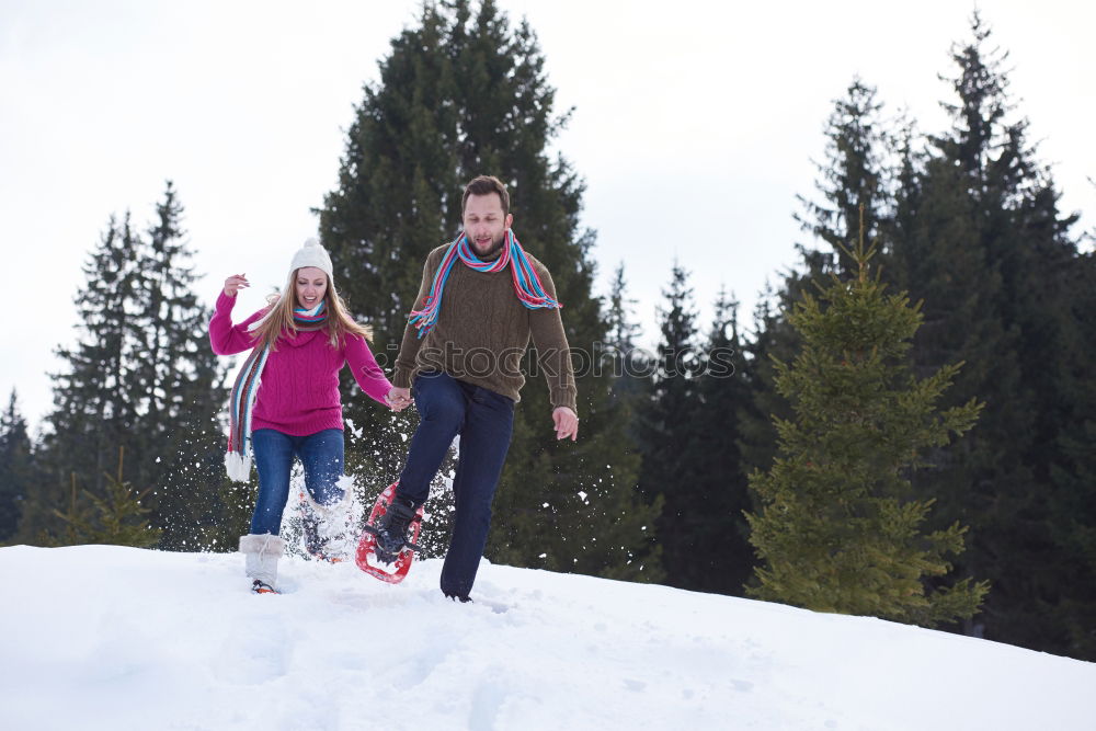 Similar – Young family with children go sledding in winter sunshine