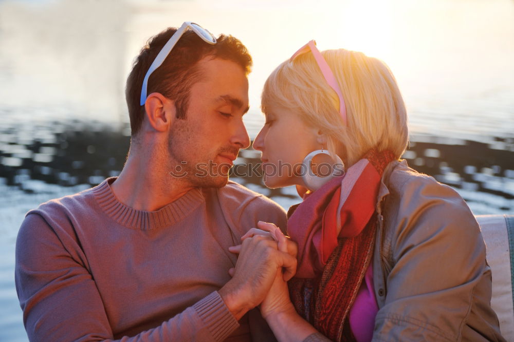 Similar – Young couple embracing and laughing outdoors under umbrella