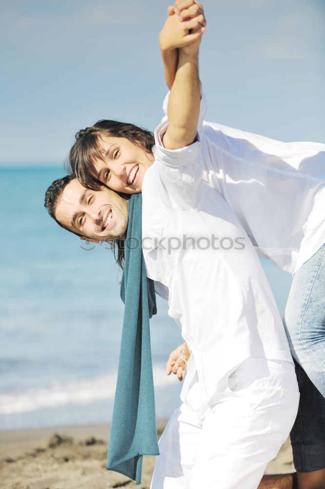 Similar – Happy father and son playing on the beach