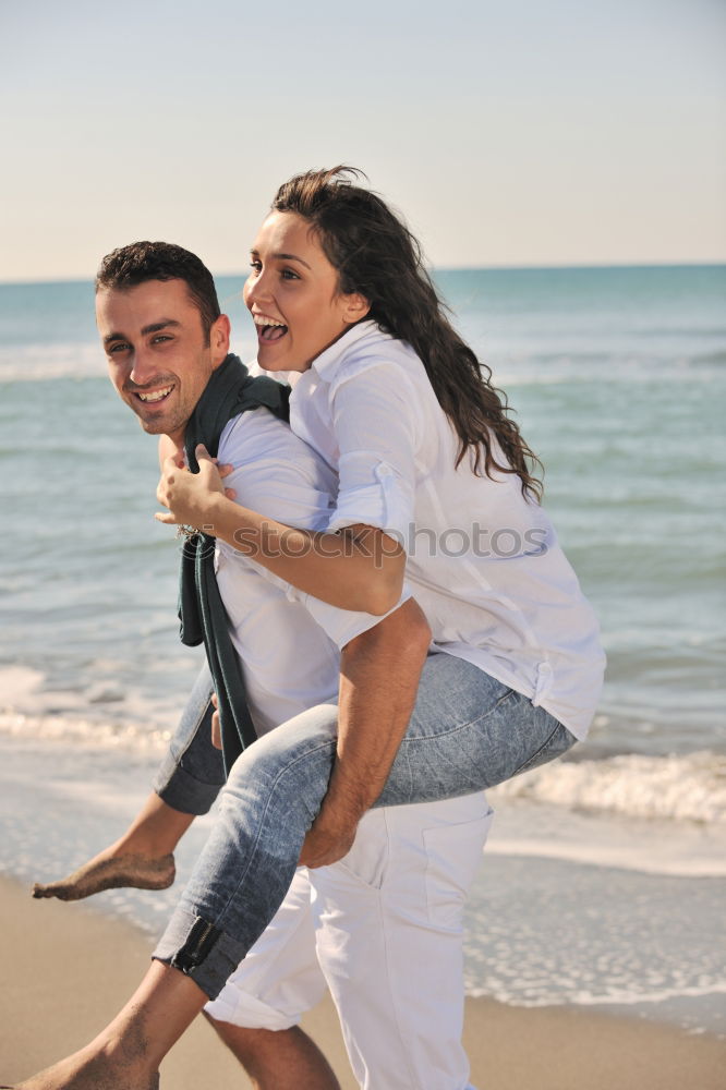 Similar – Happy father and son playing on the beach