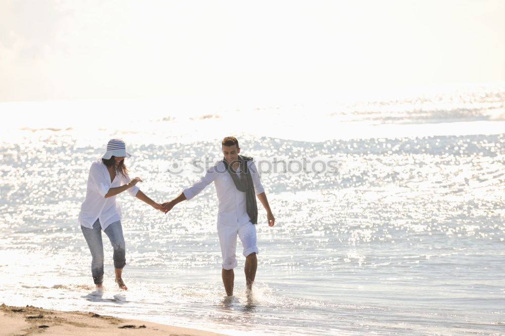 Similar – Image, Stock Photo Romantic bride and groom strolling on beach