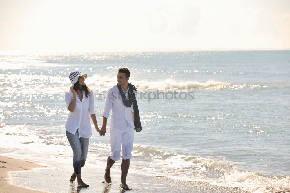 Similar – Image, Stock Photo Romantic bride and groom strolling on beach