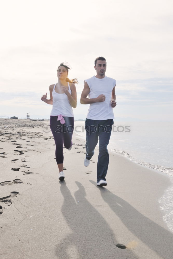 Similar – Image, Stock Photo Two sportsmen running on beach