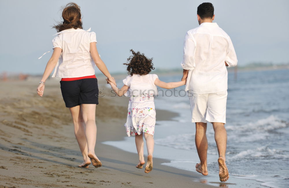 Similar – Image, Stock Photo Happy family walking on the beach at the day time. Concept of friendly family.