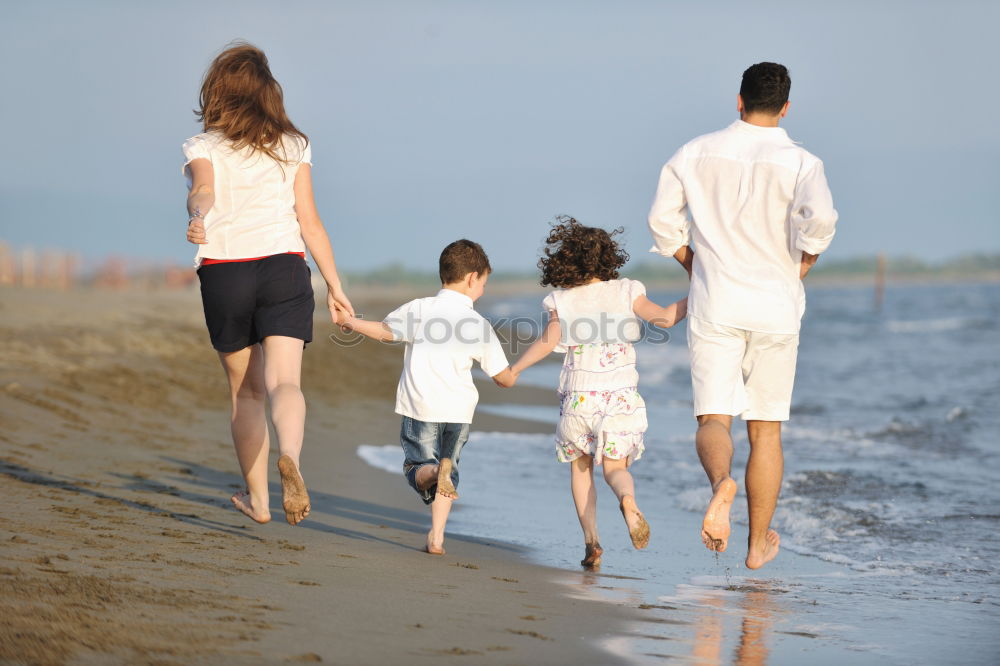 Similar – Image, Stock Photo Happy family walking on the beach at the day time. Concept of friendly family.