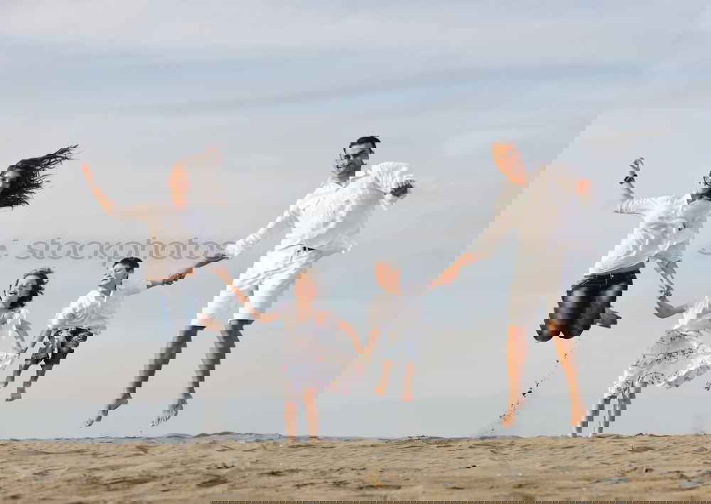 Similar – Image, Stock Photo Mother and children playing on the beach.