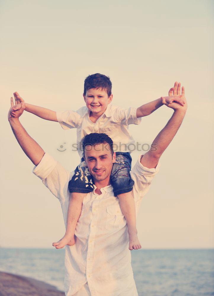 Similar – Image, Stock Photo Father and son playing on the beach at the day time.