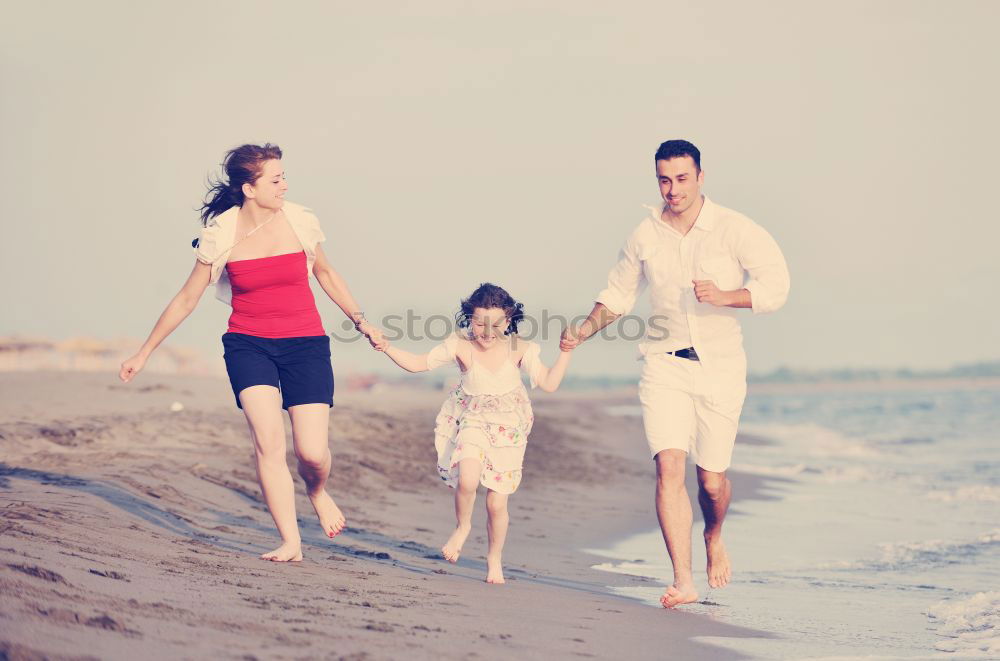 Similar – Image, Stock Photo Father and son playing on the beach at the day time. Concept of friendly family.