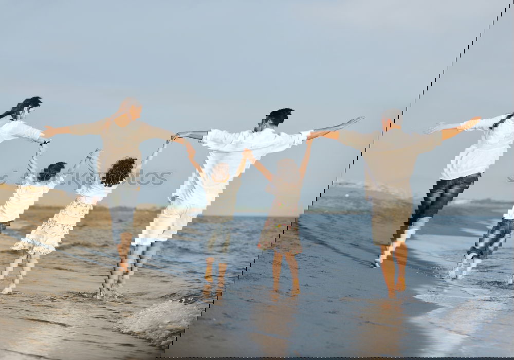 Image, Stock Photo Mother and children playing on the beach.