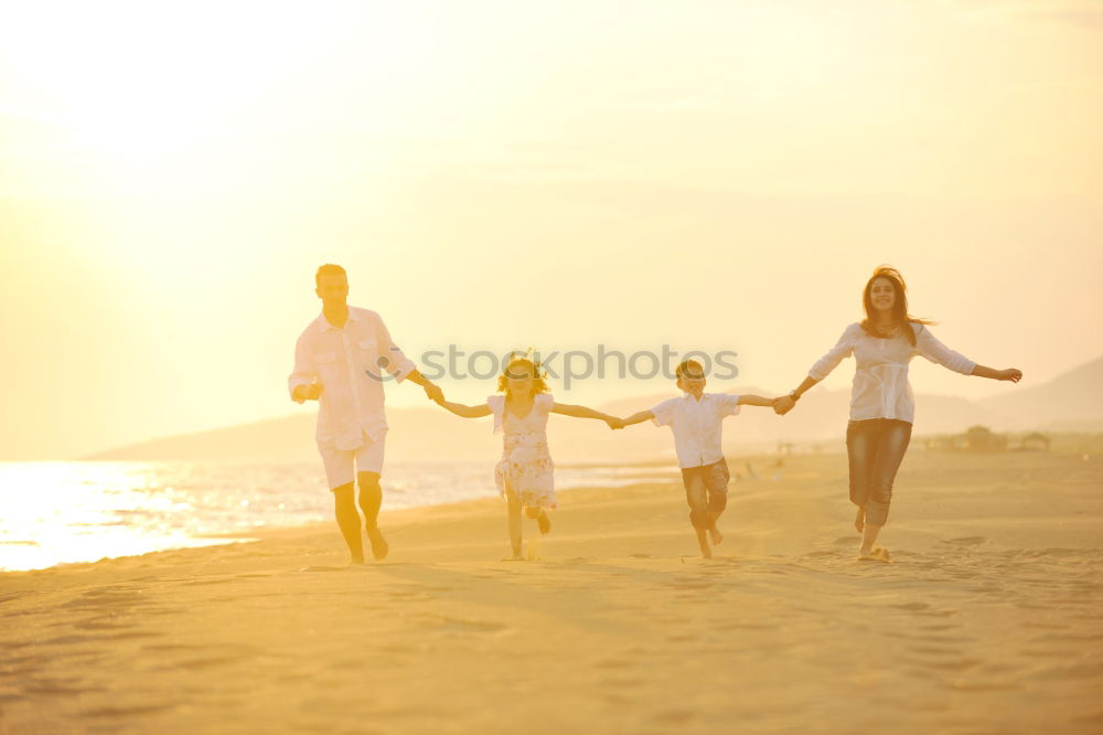 Similar – Happy children playing on the beach at the sunset time. Three Kids having fun outdoors. Concept of summer vacation and friendly family.