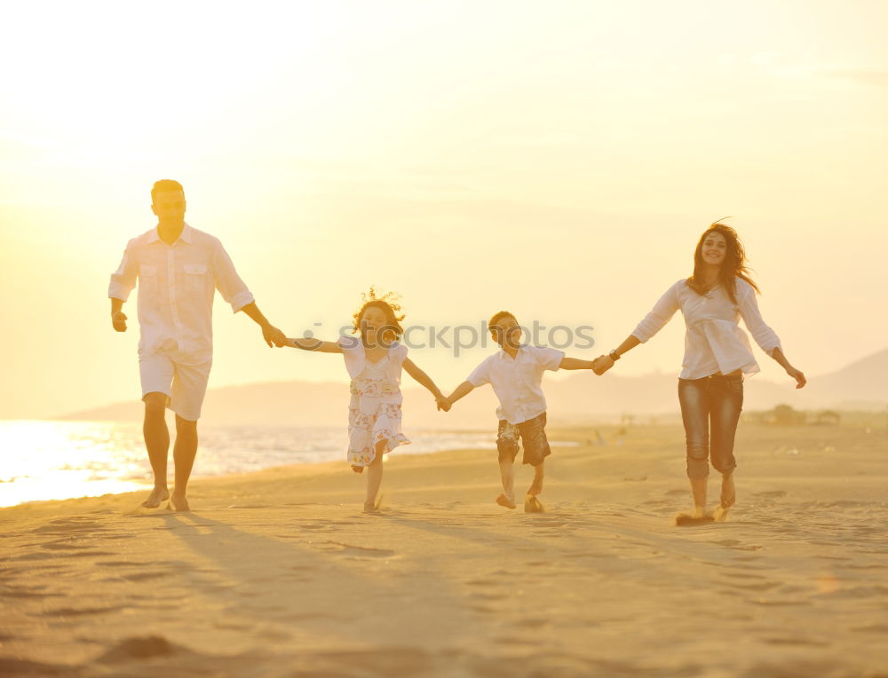 Similar – Happy children playing on the beach at the sunset time. Three Kids having fun outdoors. Concept of summer vacation and friendly family.