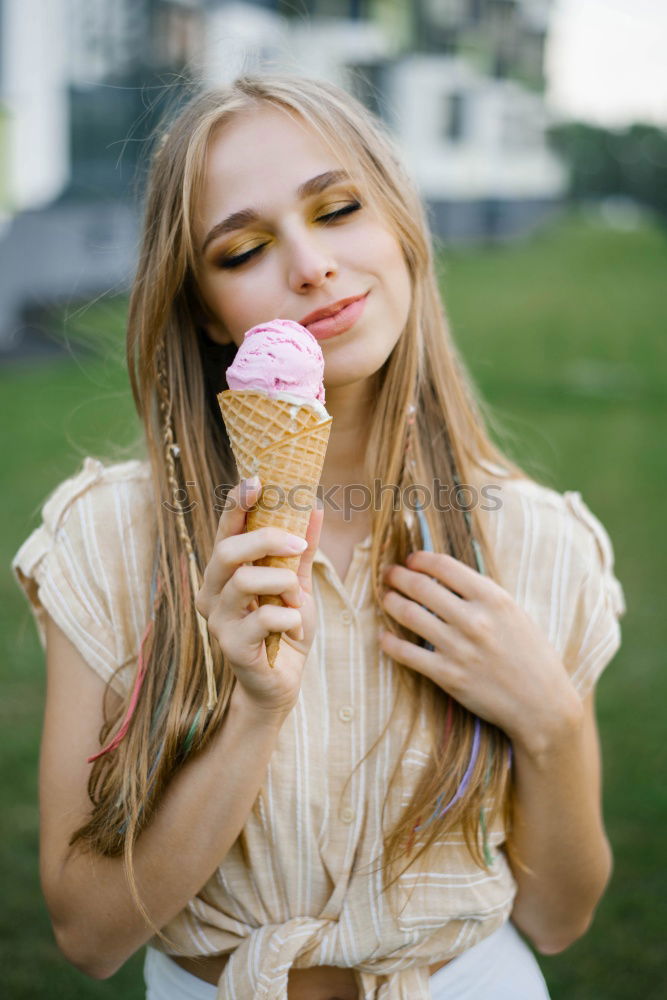 Similar – Girls eating ice cream on the promenade in summer holiday