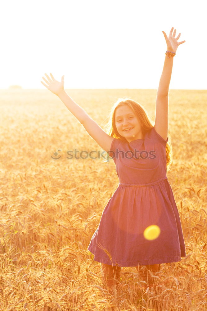 Similar – Image, Stock Photo Young woman with yellow dress and hat walks in the countryside.