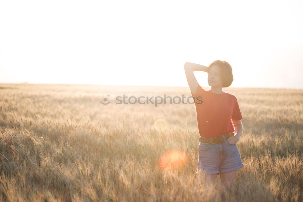 Similar – Young woman posing on a hill