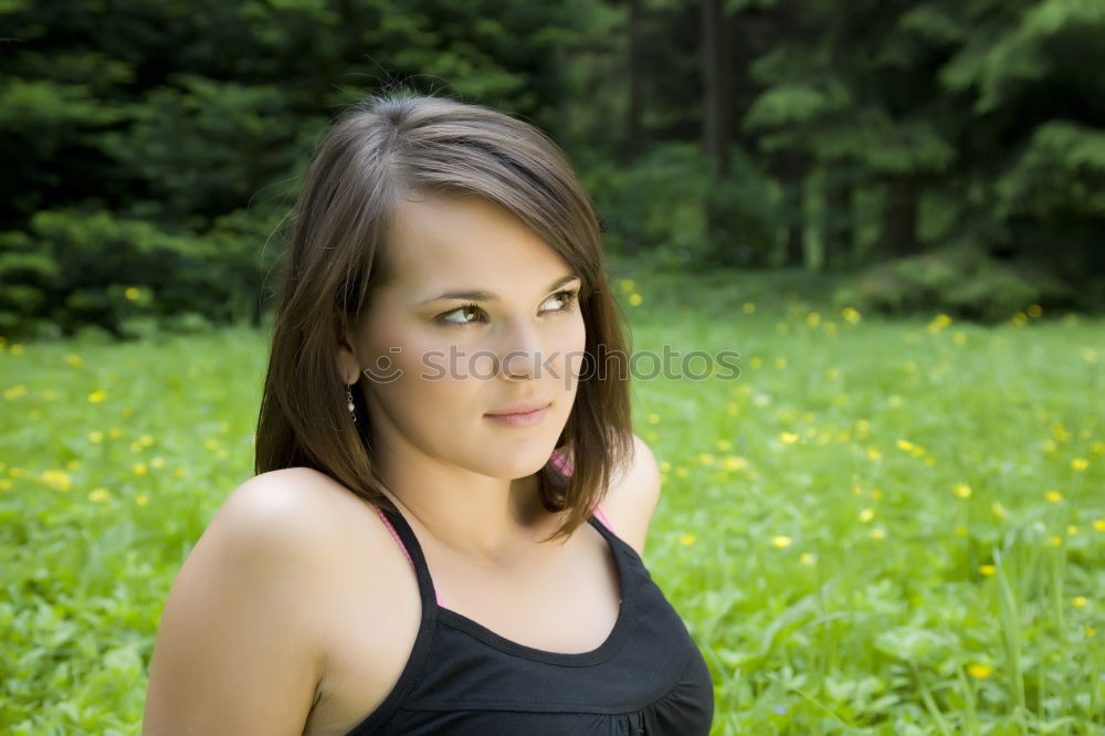 Similar – Young woman with freckles sits on a high flat roof in the evening light and smiles at the camera