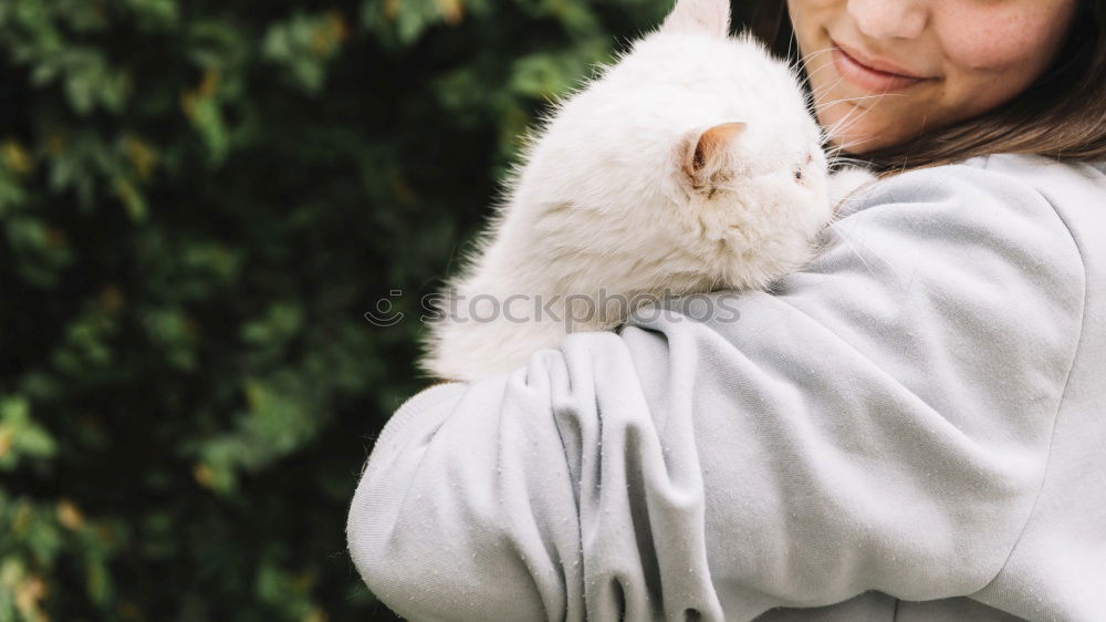 Similar – Young happy woman hugging her dog