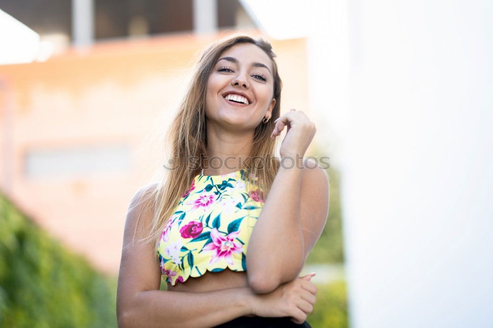 Similar – Smiling young woman with brown wavy hair outdoors