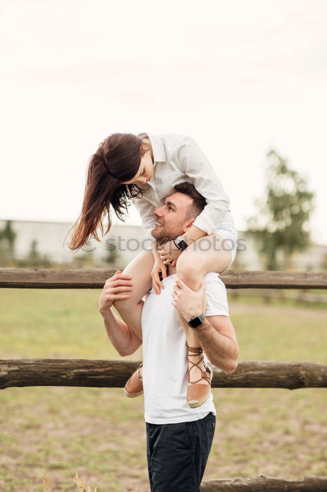 Similar – Happy girlfriend jumping on boyfriend’s back in the street