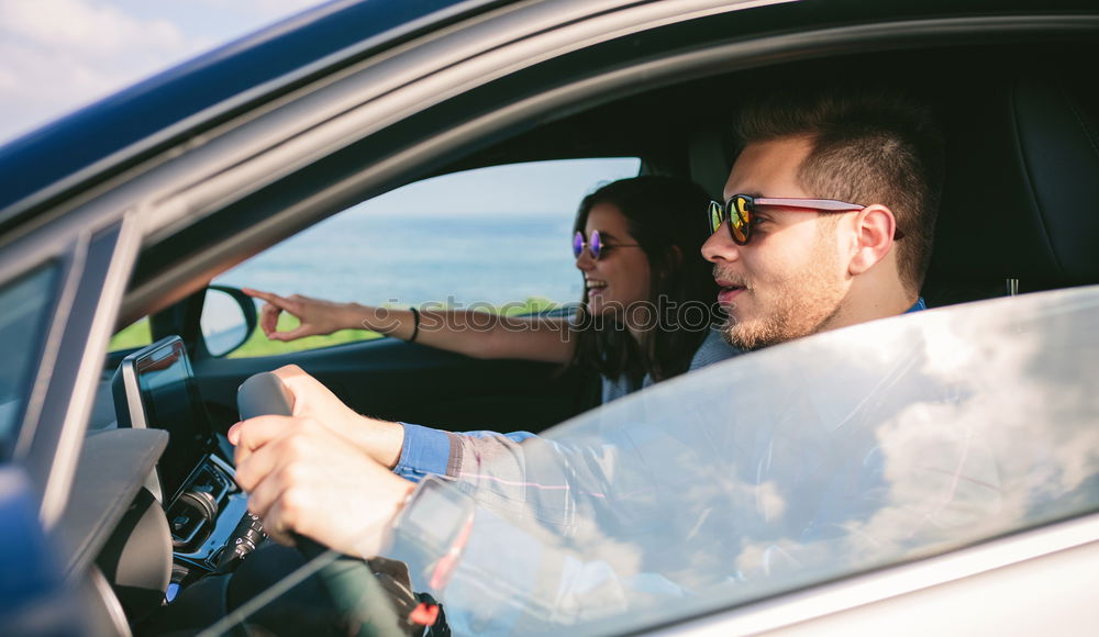 Similar – Image, Stock Photo Young man holding steering driving