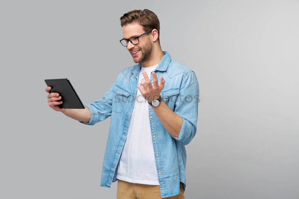 Similar – Man using his mobile phone.